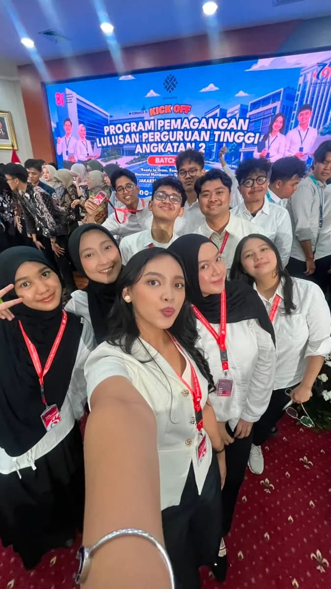 Group selfie at an indoor event